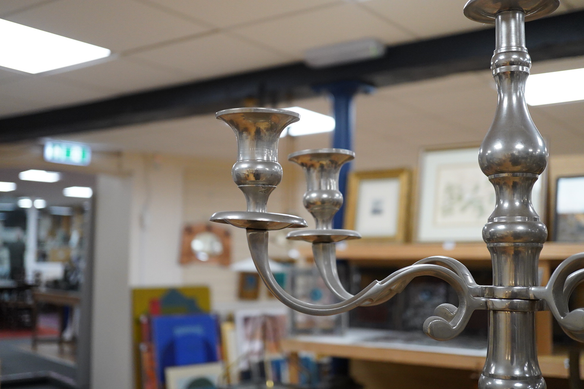 A pair of tall pewter four branch, five light candelabra, 105cm high